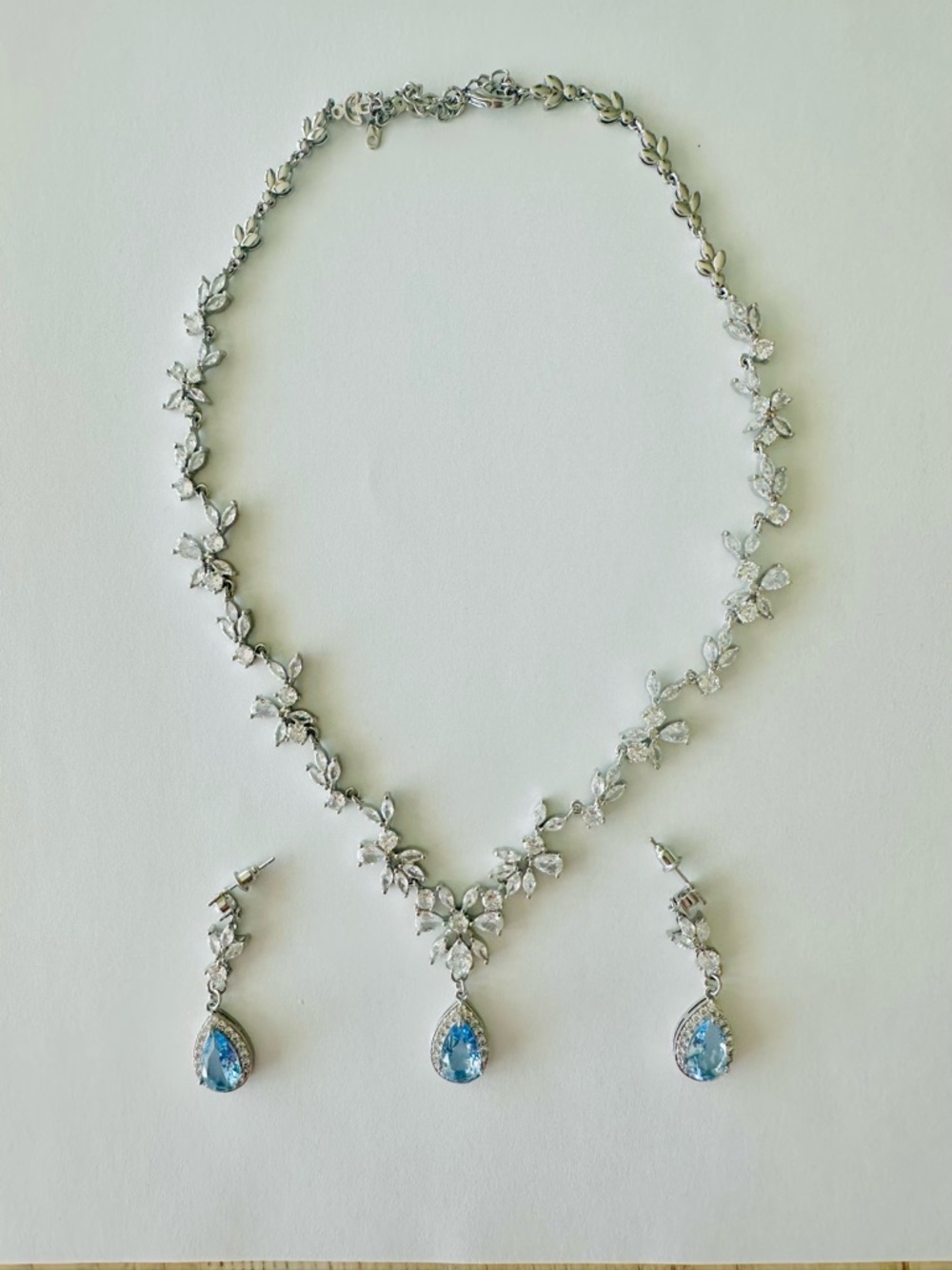 Elegant Silver Floral Necklace and Blue Teardrop Earrings Set